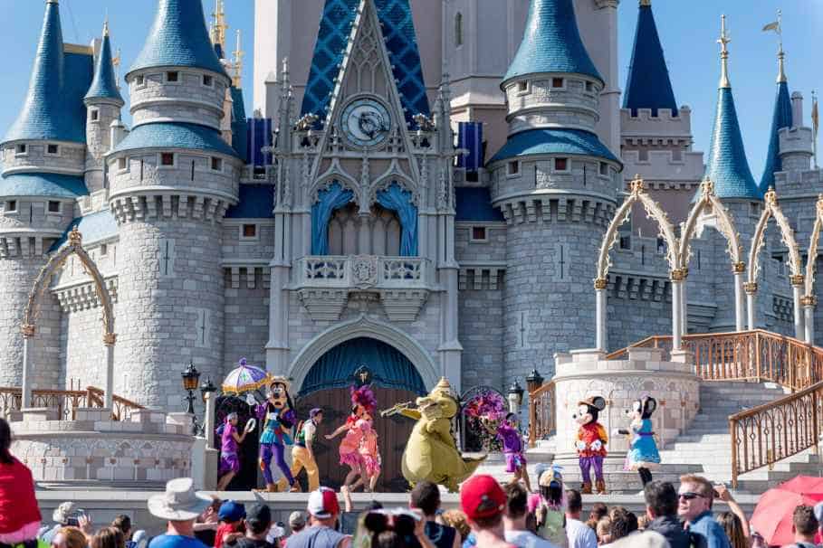 Crowd Watching Performance in front of Magic Kingdom Castle on a Sunny Day
