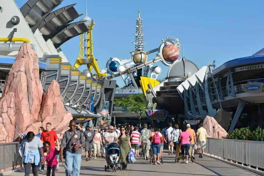 Families Happily Strolling in Tomorrowland at the Magic Kingdom
