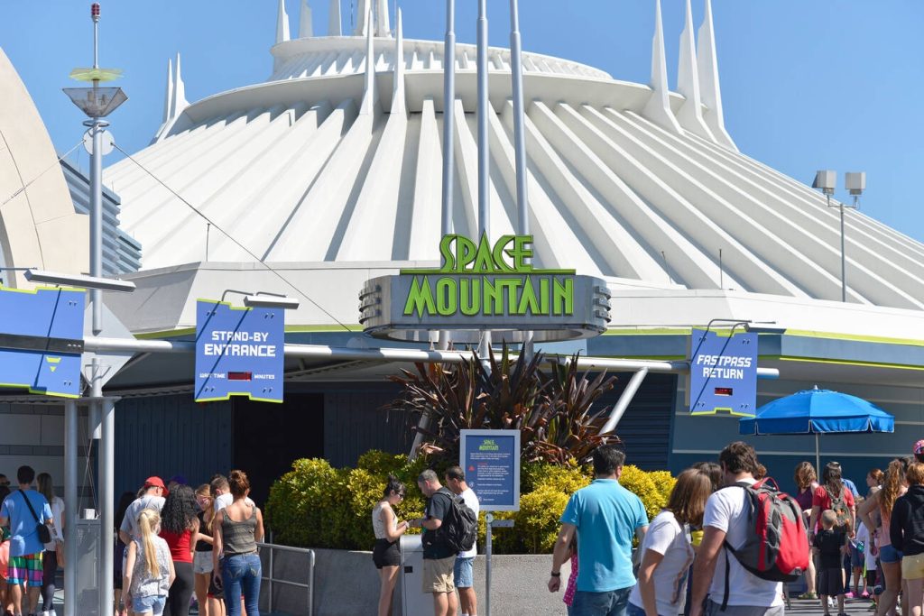 People Waiting near the entrance to take a ride in Space Mountain at Magic Kingdom